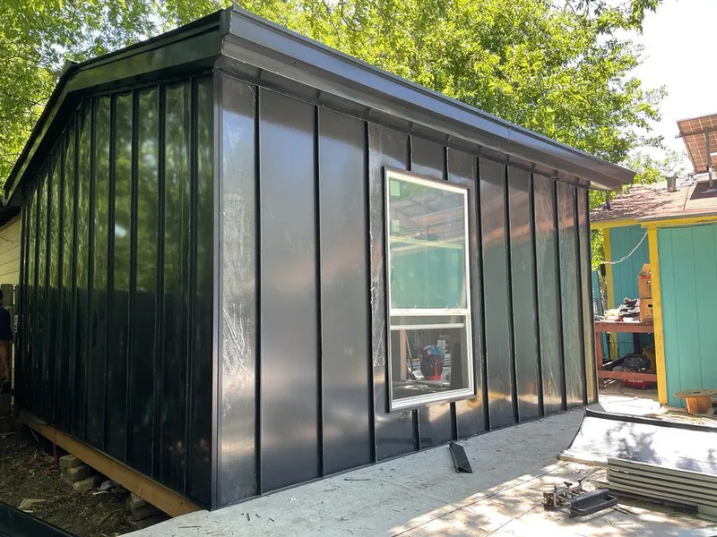 Black standing seam metal wall panels for Roof Inspection in Robinwood